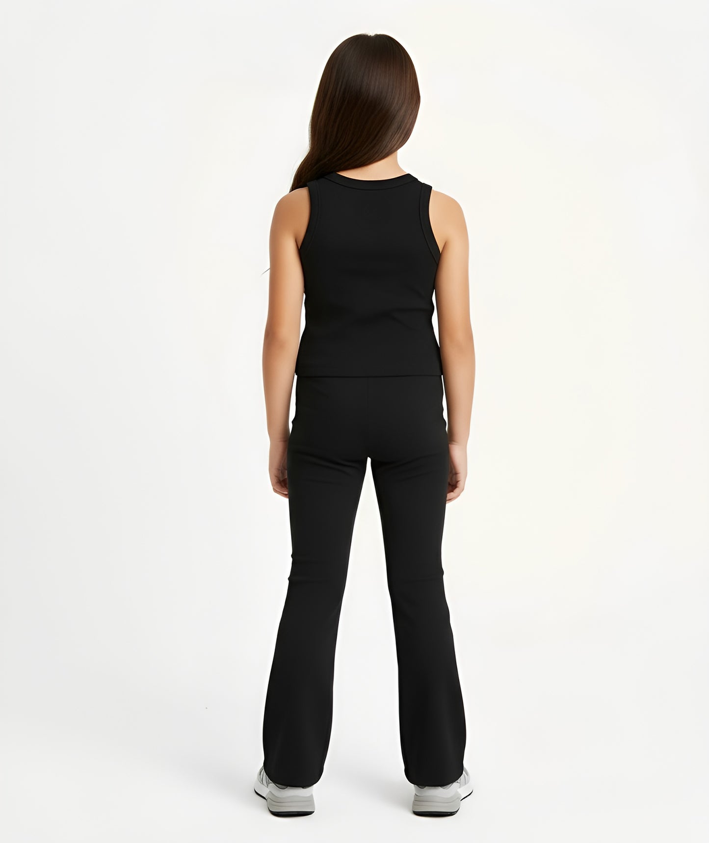 Back view of girl wearing Goldencubs charcoal cotton tank top and matching flared pants, showing soft cotton texture.