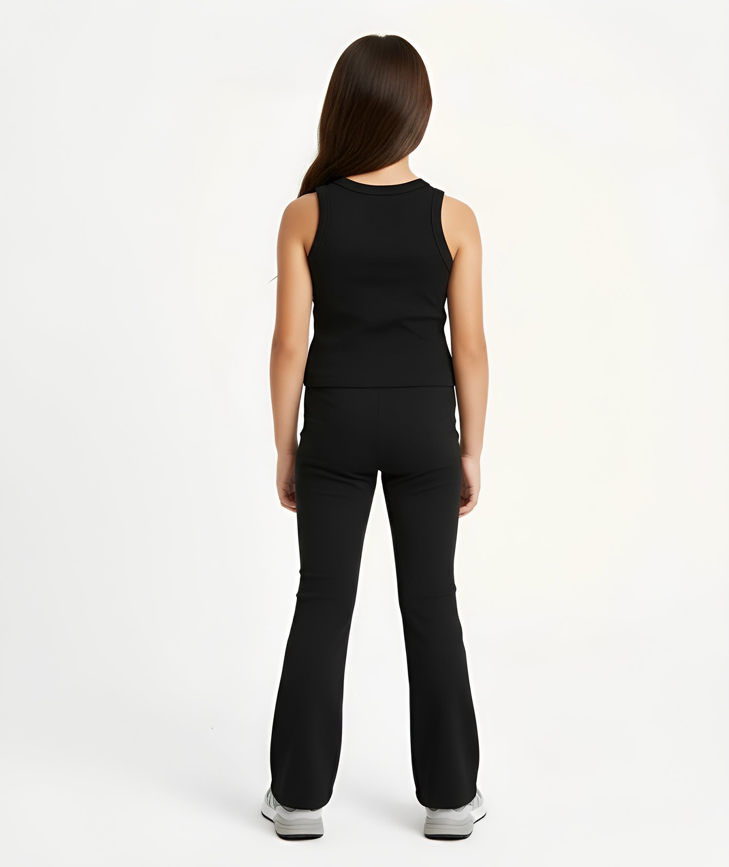 Back view of girl wearing Goldencubs charcoal cotton tank top and matching flared pants, showing soft cotton texture.