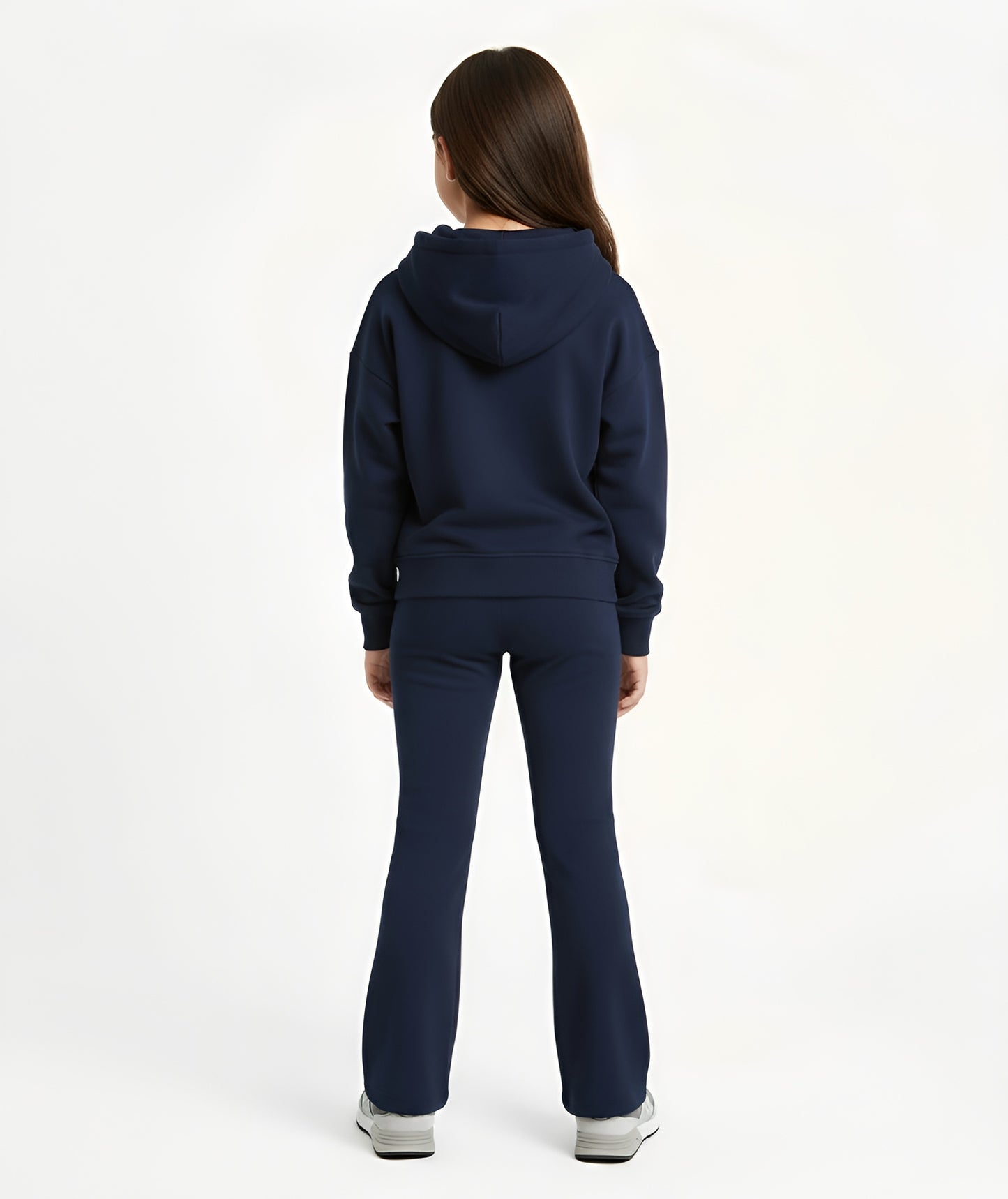 Back view of girl wearing Goldencubs navy cotton flared pants, showing smooth fit and relaxed flared silhouette.