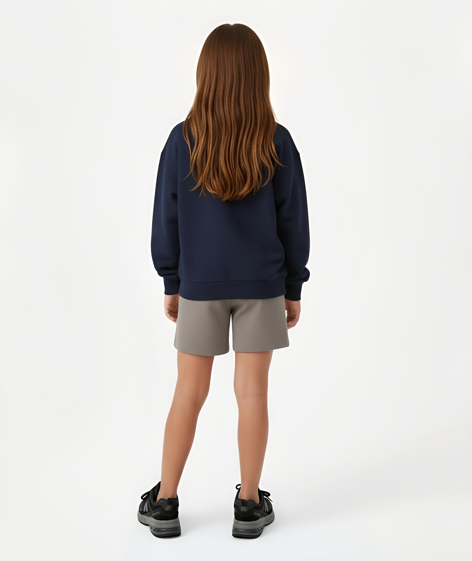 Back view of girl wearing Goldencubs navy cotton sweatshirt, showing relaxed fit and soft cotton fabric.