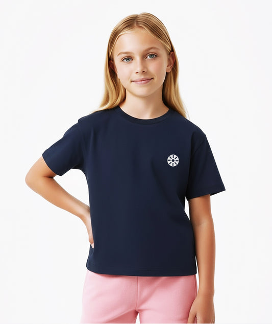 Girl in navy Goldencubs cotton T-shirt featuring short sleeves and chest logo detail, styled casually.