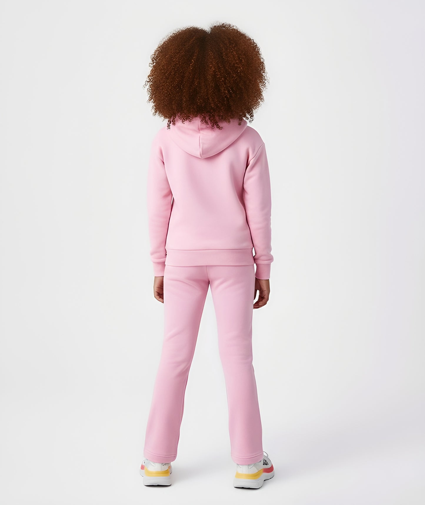 Back view of girl wearing Goldencubs pink cotton hoodie, showing relaxed fit and soft cotton texture.