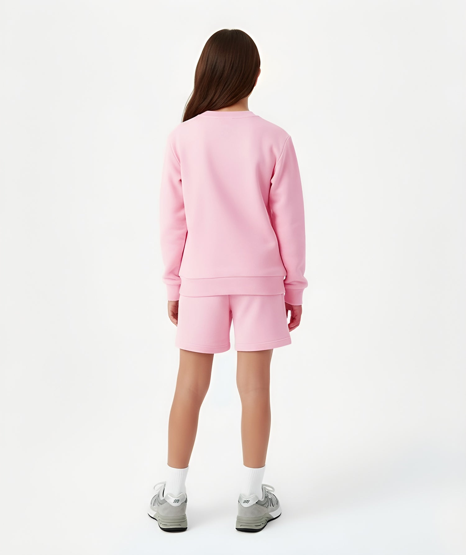 Back view of girl wearing Goldencubs pink cotton shorts, showing elastic waistband and comfortable fit.