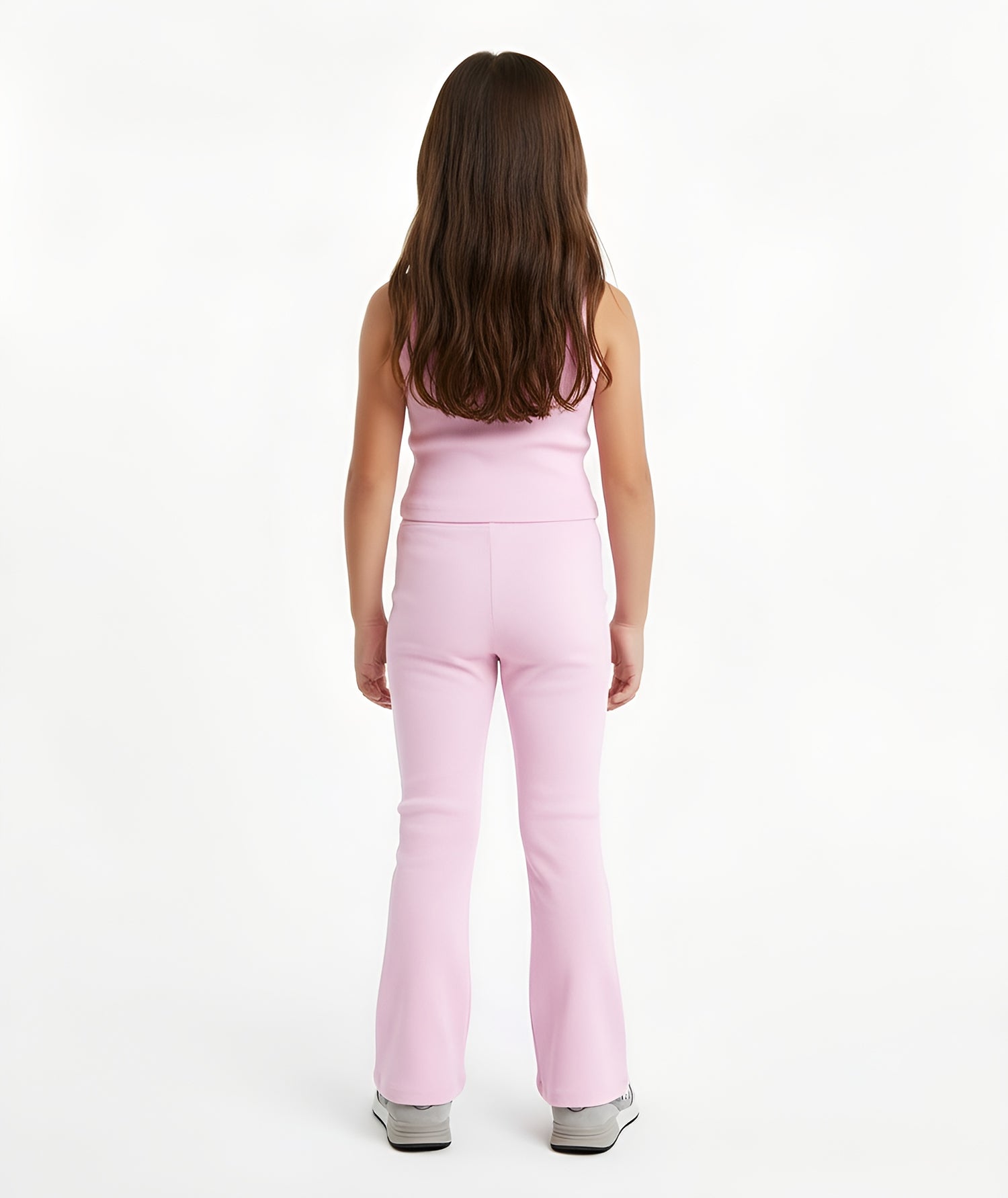 Back view of girl wearing Goldencubs pink cotton tank top, showing fitted ribbed design and smooth seams.