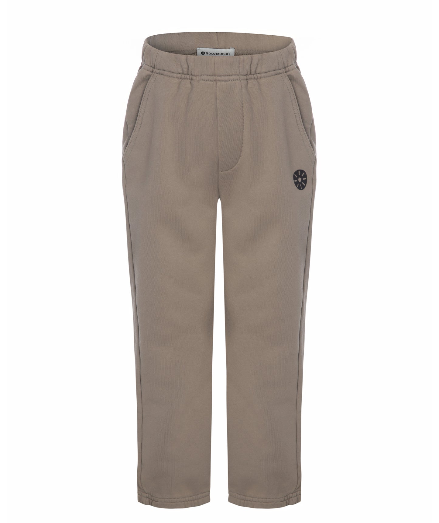 Front view of Goldencubs girls taupe cotton sweatpants laid flat on white background, featuring soft cotton texture and logo patch.
