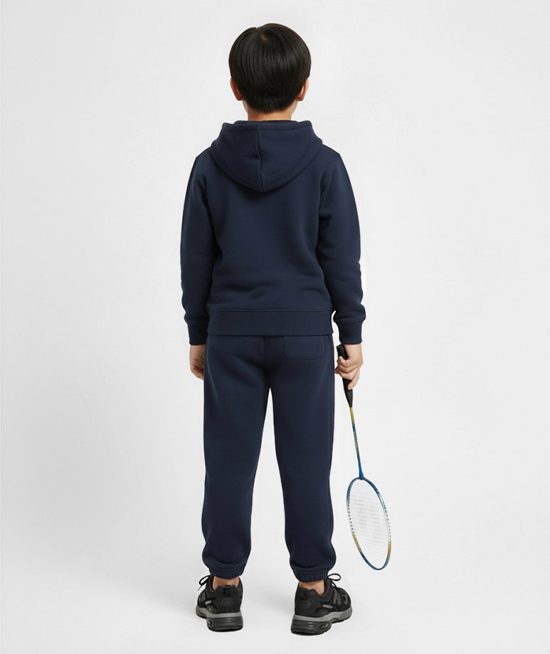 Back view of boy wearing Goldencubs navy cotton sweatpants and matching hoodie — relaxed fit and comfortable kids athleisurewear for everyday play.