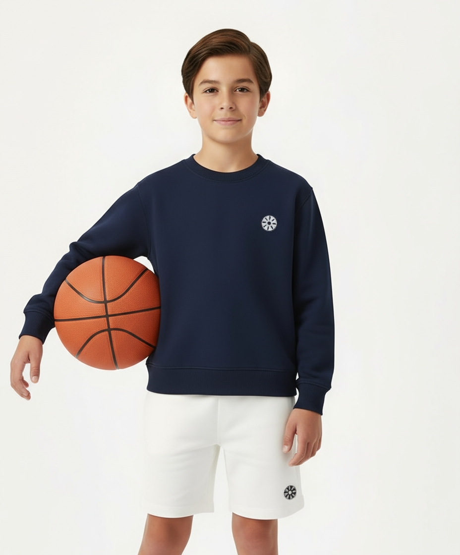 Close-up of boy wearing Goldencubs navy cotton sweatshirt featuring circular black logo patch — premium and soft cotton fabric for everyday comfort.