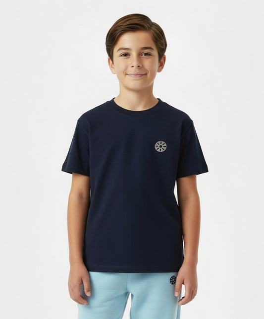 Close-up of boy wearing Goldencubs navy cotton T-shirt with black circular logo patch — premium cotton kids T-shirt for casual and sporty occasions.