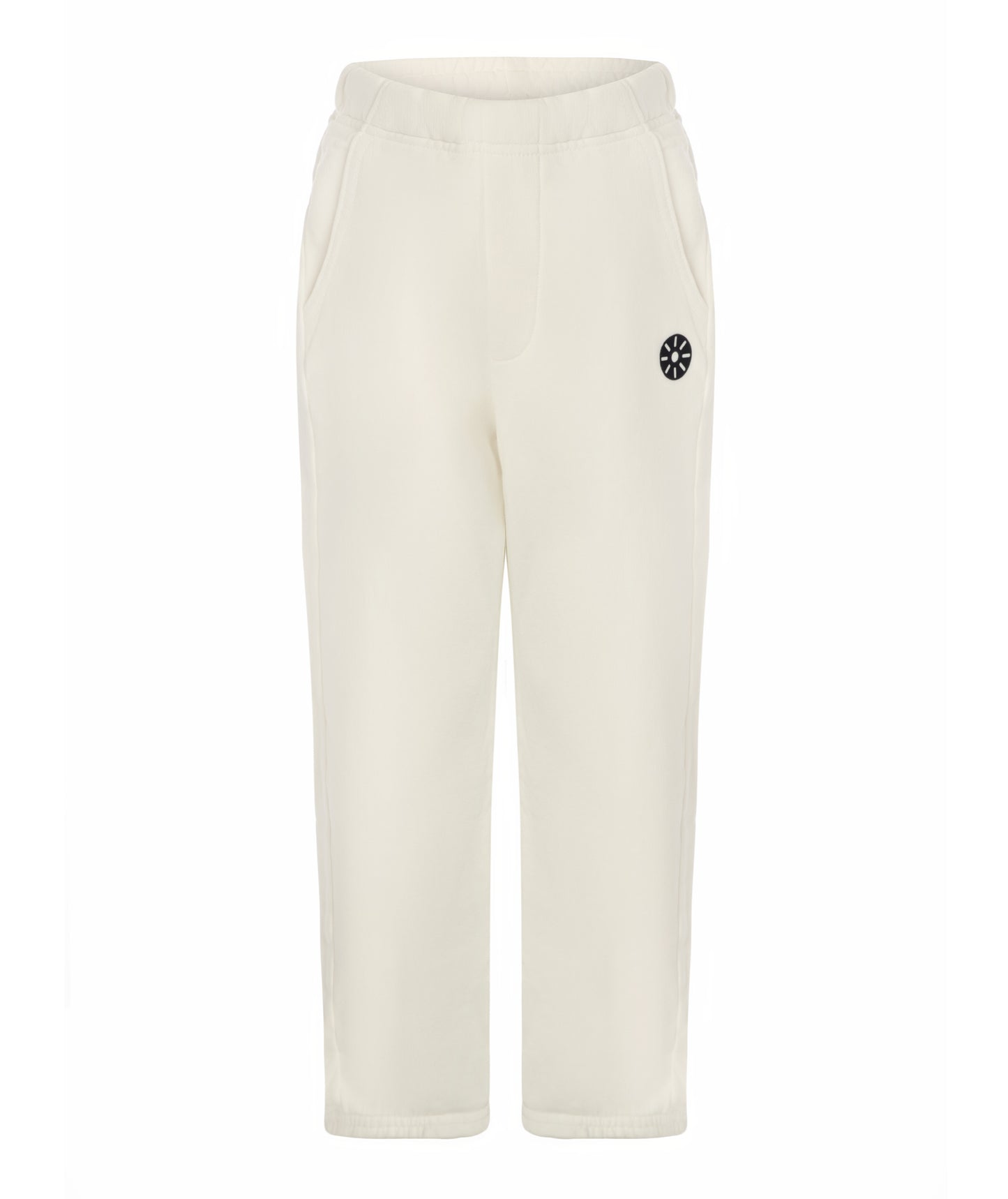 Front view of Goldencubs white cotton girls sweatpants featuring elastic waistband, side pockets, and black logo patch — soft and stylish kids athleisurewear.