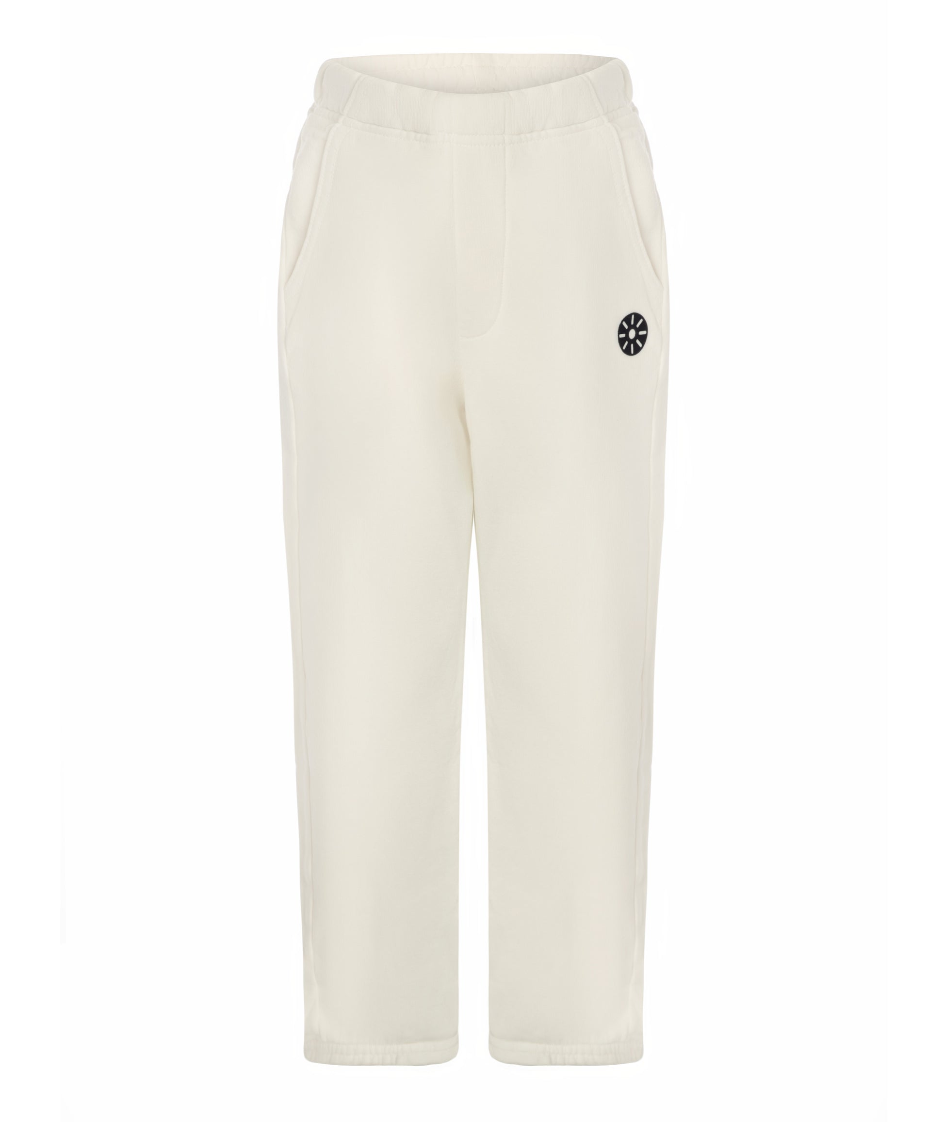 Front view of Goldencubs white cotton girls sweatpants featuring elastic waistband, side pockets, and black logo patch — soft and stylish kids athleisurewear.