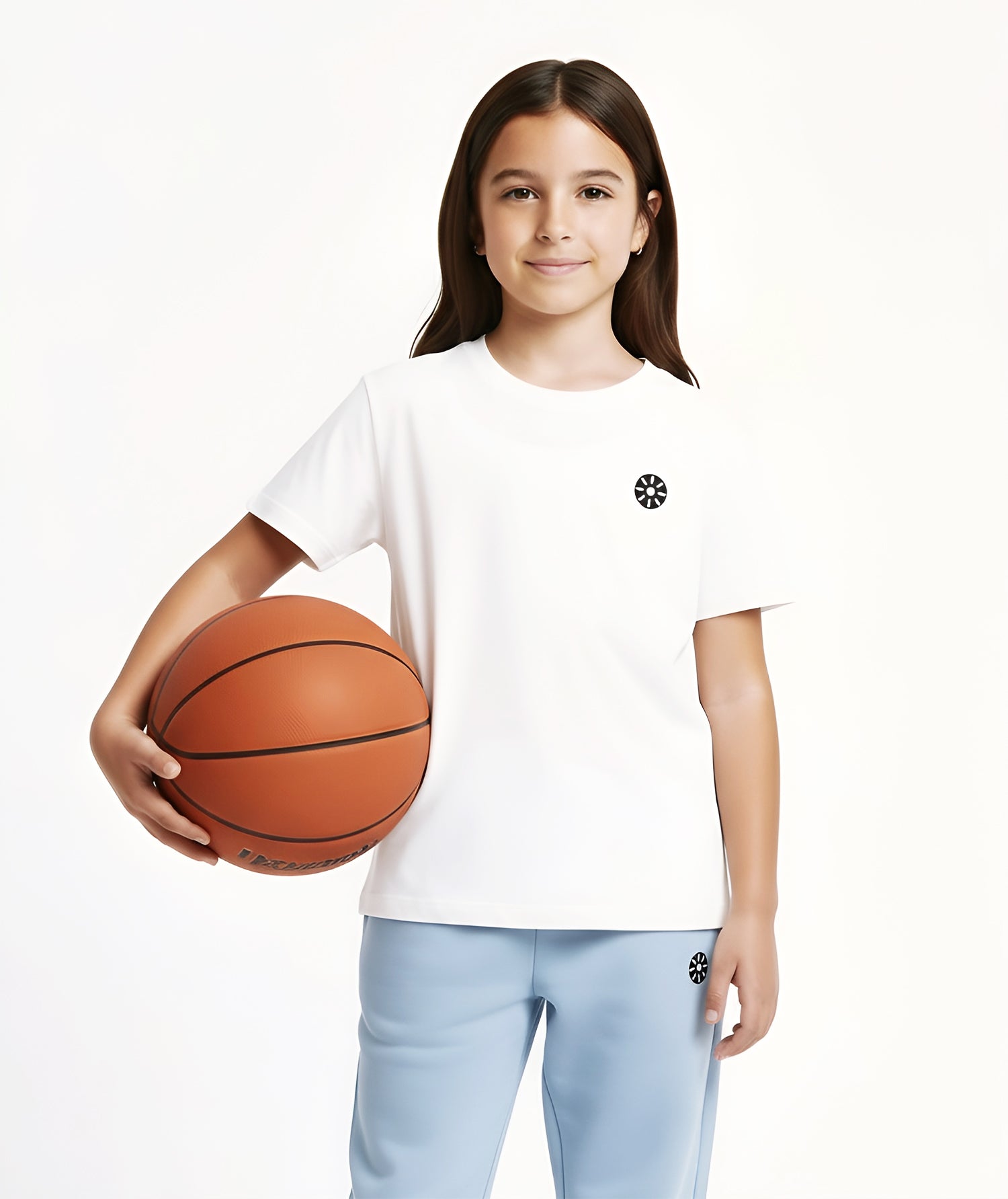 Close-up of a girl wearing a premium white cotton T-shirt with a small black logo detail, paired with light blue joggers for a clean and modern athleisure look.