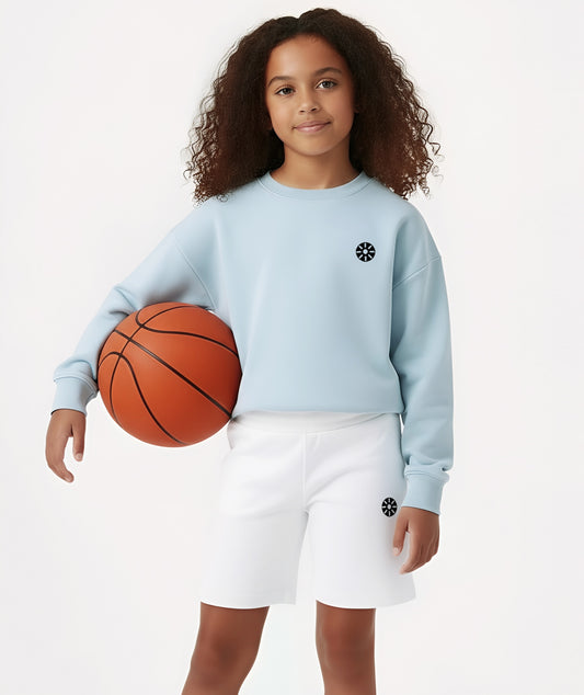 Close-up of Goldencubs girls baby blue cotton sweatshirt featuring a minimalist logo, showcasing the smooth cotton texture and modern athleisure design.
