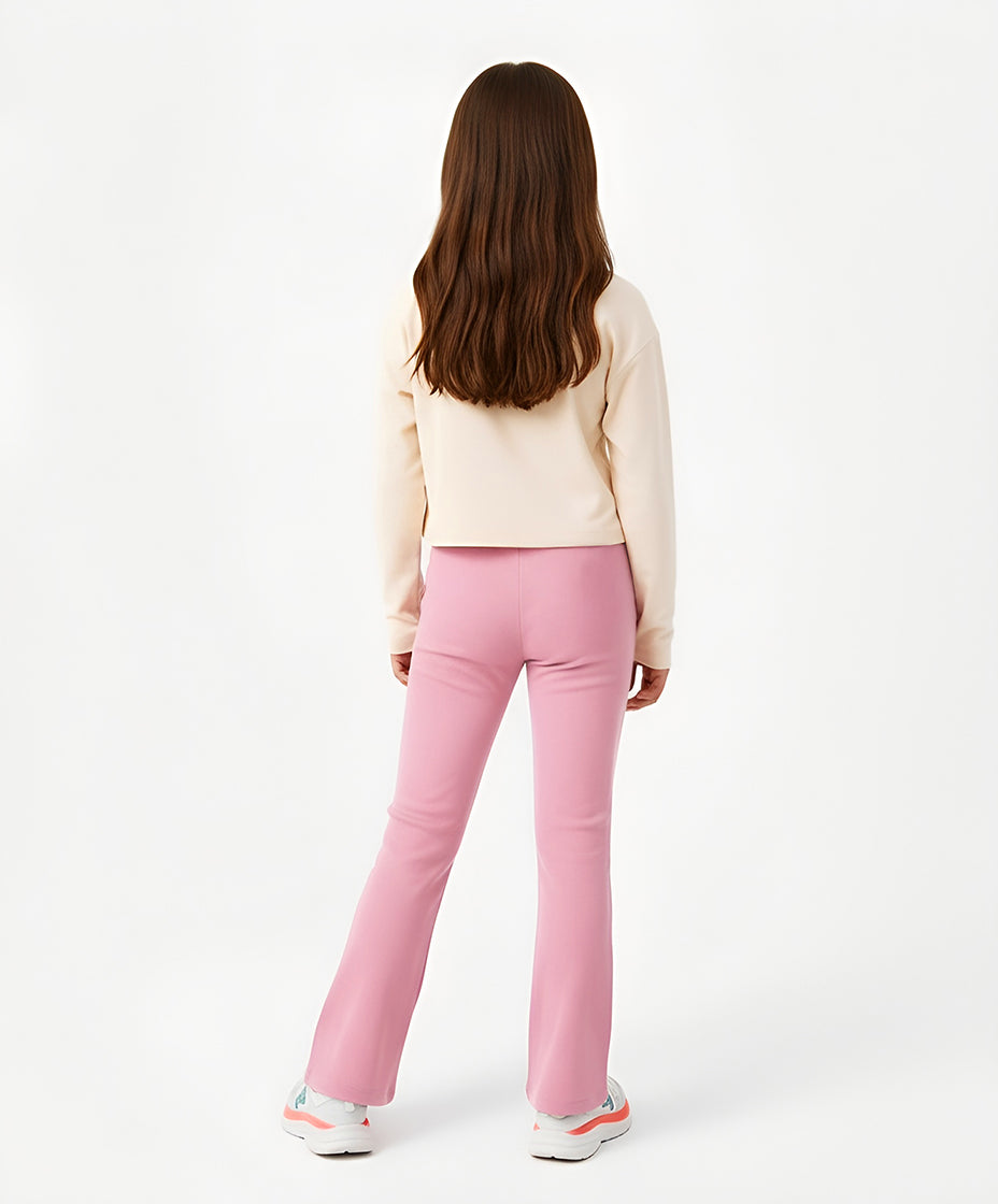 Rear view of Goldencubs girls cream cotton long sleeve T-shirt and pink pants, highlighting the soft premium cotton fabric and relaxed fit for all-day wear.