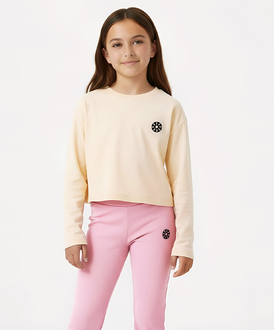 Goldencubs girls cream cotton long sleeve T-shirt paired with pink flared pants, designed for cozy days and stylish comfort. Perfect for school, lounging, or playtime.